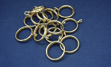 Ring with metal eyelet