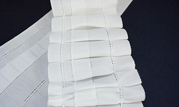 Self-pleating tape